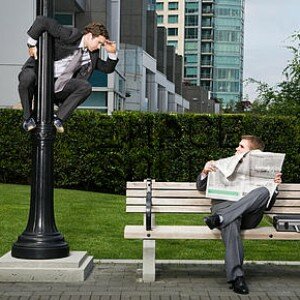 Businessman spying on colleague